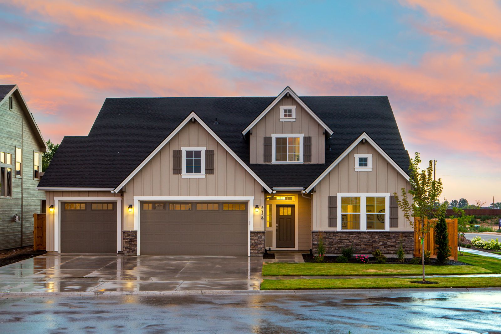 A family home at dusk with warm lights on, the kind of property Australians research for months before acting